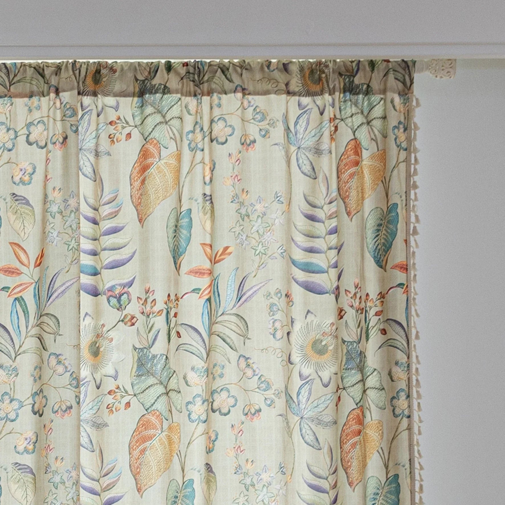 Elegant botanical curtain with a soft beige base, featuring hand-painted style floral and leaf patterns in warm earthy tones and muted pastels, finished with white tassel trim — perfect for bringing a fresh, nature-inspired charm to your home décor.