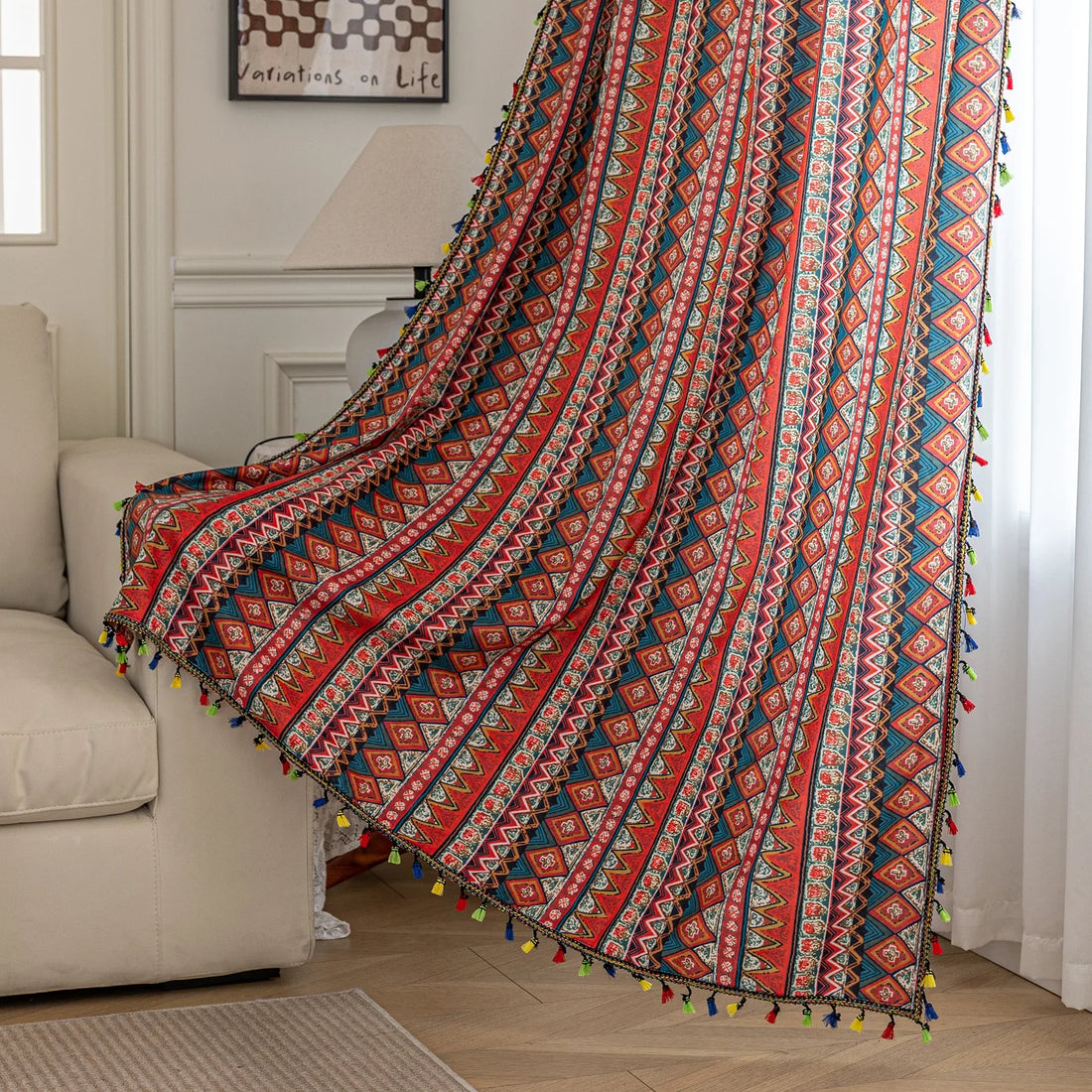 Bold tribal-inspired curtain with vibrant red, blue, and yellow geometric diamond patterns, accented by colorful tassel trim — perfect for adding a touch of ethnic charm and warmth to any bohemian or eclectic home décor.