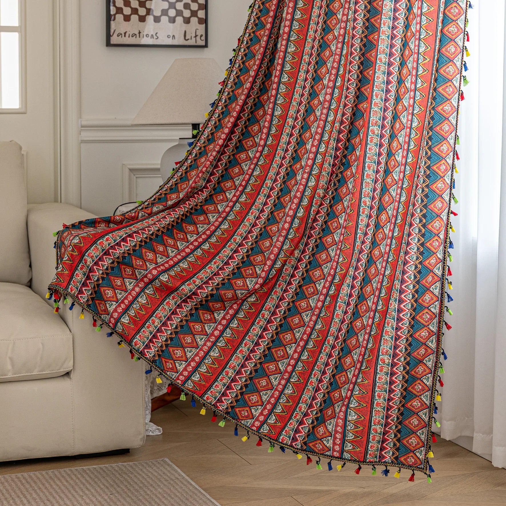 Bold tribal-inspired curtain with vibrant red, blue, and yellow geometric diamond patterns, accented by colorful tassel trim — perfect for adding a touch of ethnic charm and warmth to any bohemian or eclectic home décor.
