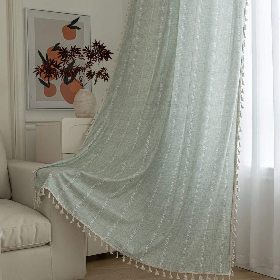 Minimalist sage green curtain with subtle vertical white embroidery and delicate tassel edging — perfect for creating a fresh, airy, and elegant atmosphere in any living room, bedroom, or dining space.
