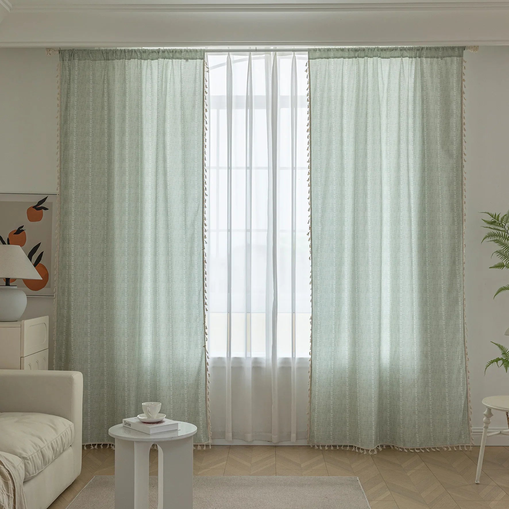 Minimalist sage green curtain with subtle vertical white embroidery and delicate tassel edging — perfect for creating a fresh, airy, and elegant atmosphere in any living room, bedroom, or dining space.