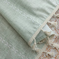 Minimalist sage green curtain with subtle vertical white embroidery and delicate tassel edging — perfect for creating a fresh, airy, and elegant atmosphere in any living room, bedroom, or dining space.