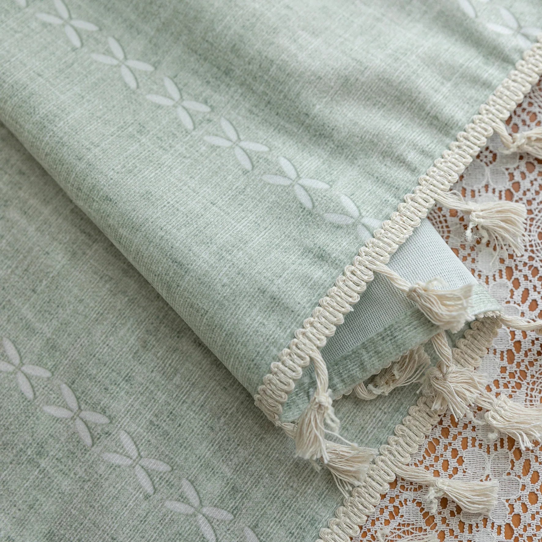 Minimalist sage green curtain with subtle vertical white embroidery and delicate tassel edging — perfect for creating a fresh, airy, and elegant atmosphere in any living room, bedroom, or dining space.
