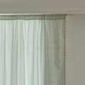 Minimalist sage green curtain with subtle vertical white embroidery and delicate tassel edging — perfect for creating a fresh, airy, and elegant atmosphere in any living room, bedroom, or dining space.