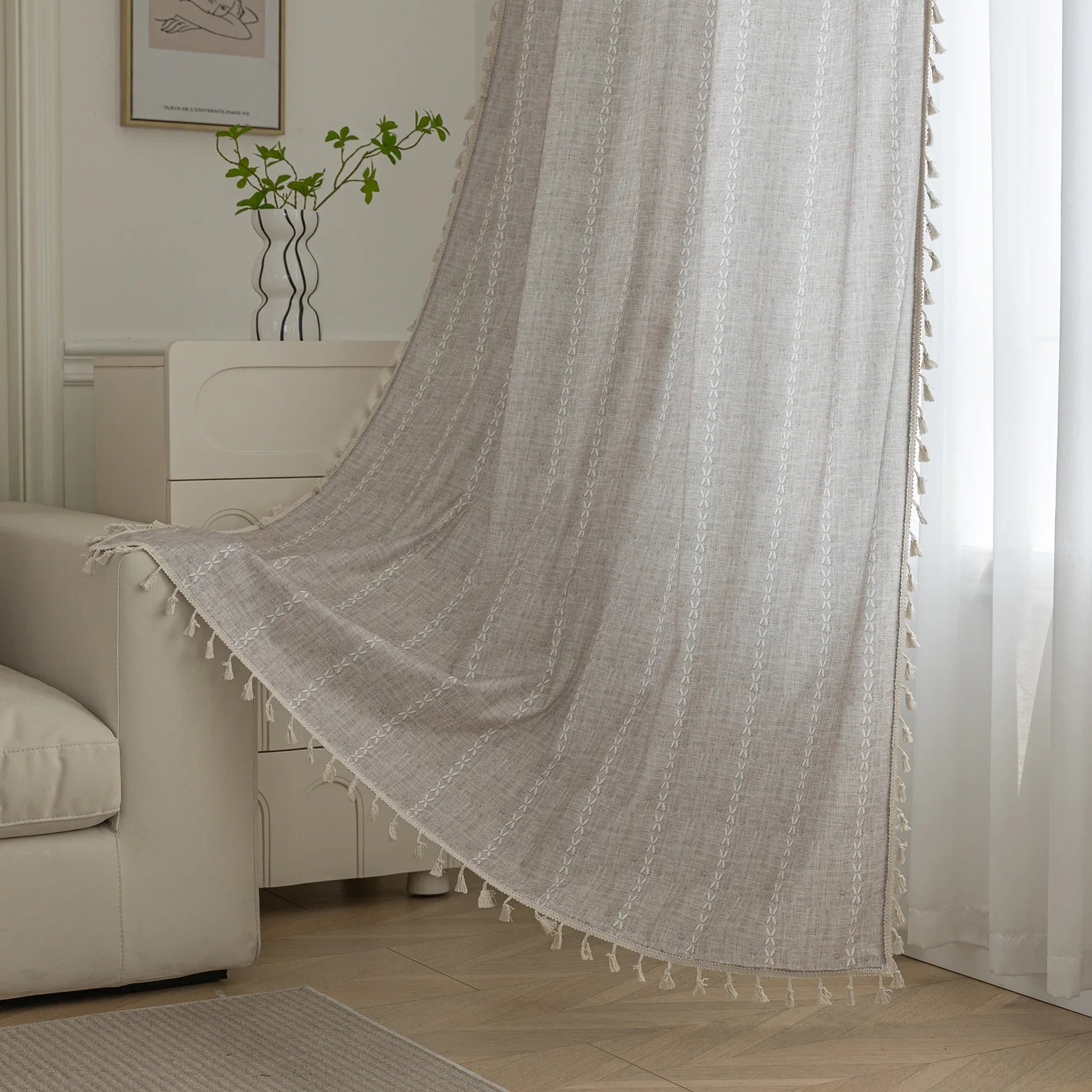 Elegant beige curtain with subtle vertical white embroidery and soft tassel trim — a versatile and timeless design that adds warmth, texture, and understated sophistication to any room decor.