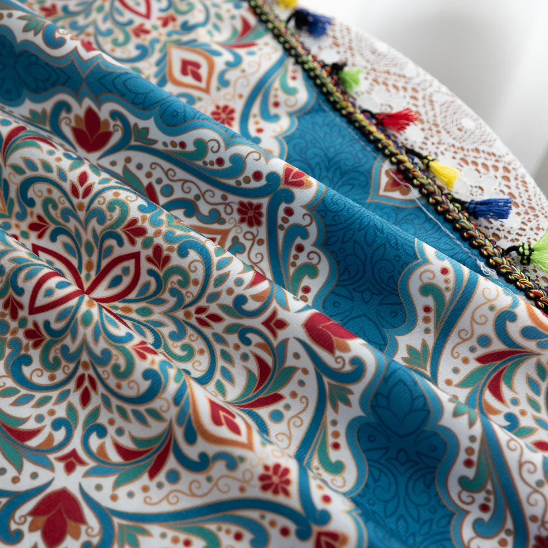 Elegant bohemian curtain featuring intricate Moroccan-inspired patterns in vibrant red, green, and gold on a rich turquoise background, finished with colorful tassel trim — perfect for adding a bold, artistic, and exotic flair to your home decor.