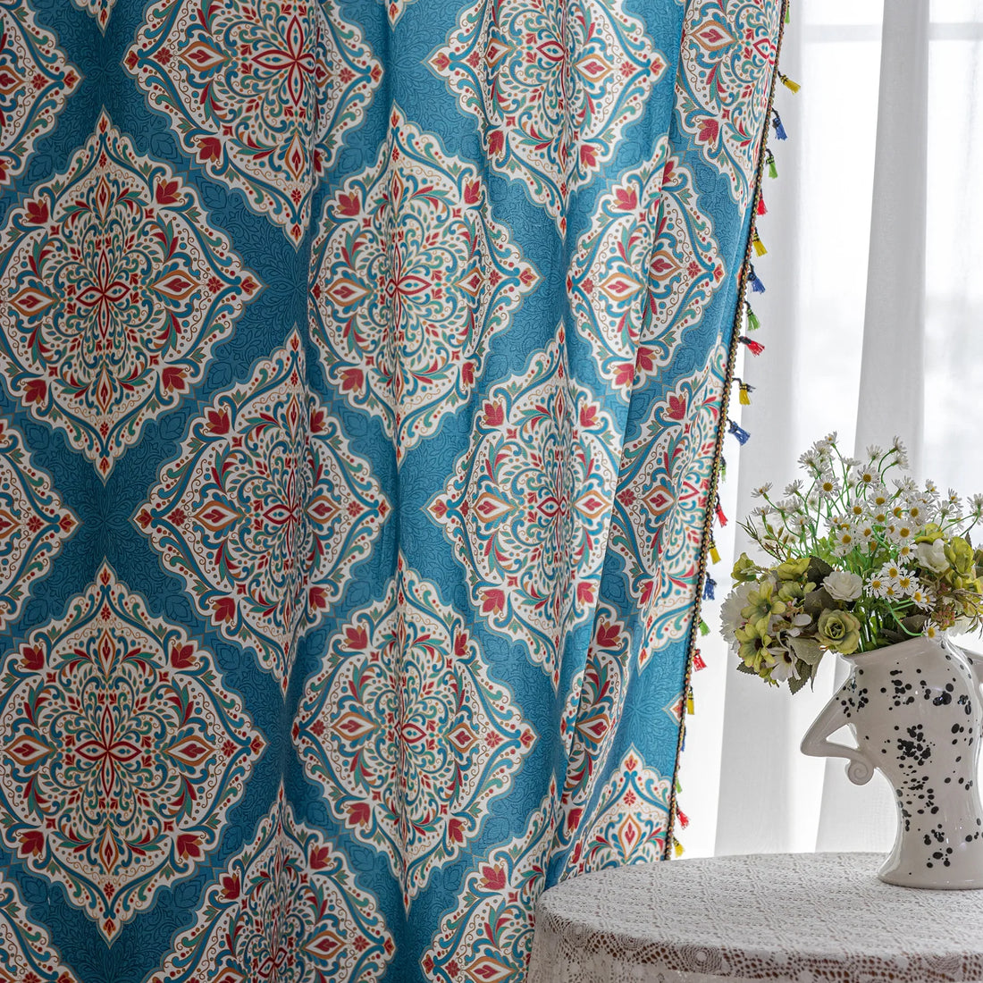 Elegant bohemian curtain featuring intricate Moroccan-inspired patterns in vibrant red, green, and gold on a rich turquoise background, finished with colorful tassel trim — perfect for adding a bold, artistic, and exotic flair to your home decor.
