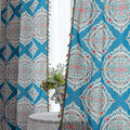 Elegant bohemian curtain featuring intricate Moroccan-inspired patterns in vibrant red, green, and gold on a rich turquoise background, finished with colorful tassel trim — perfect for adding a bold, artistic, and exotic flair to your home decor.