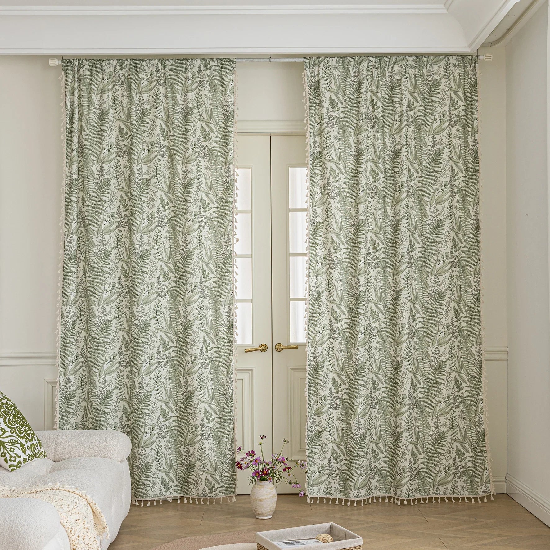 Botanical-themed curtain featuring lush green fern and leaf prints on a soft beige background, accented with delicate tassel trim — perfect for bringing a fresh, natural, and calming touch to any living space.