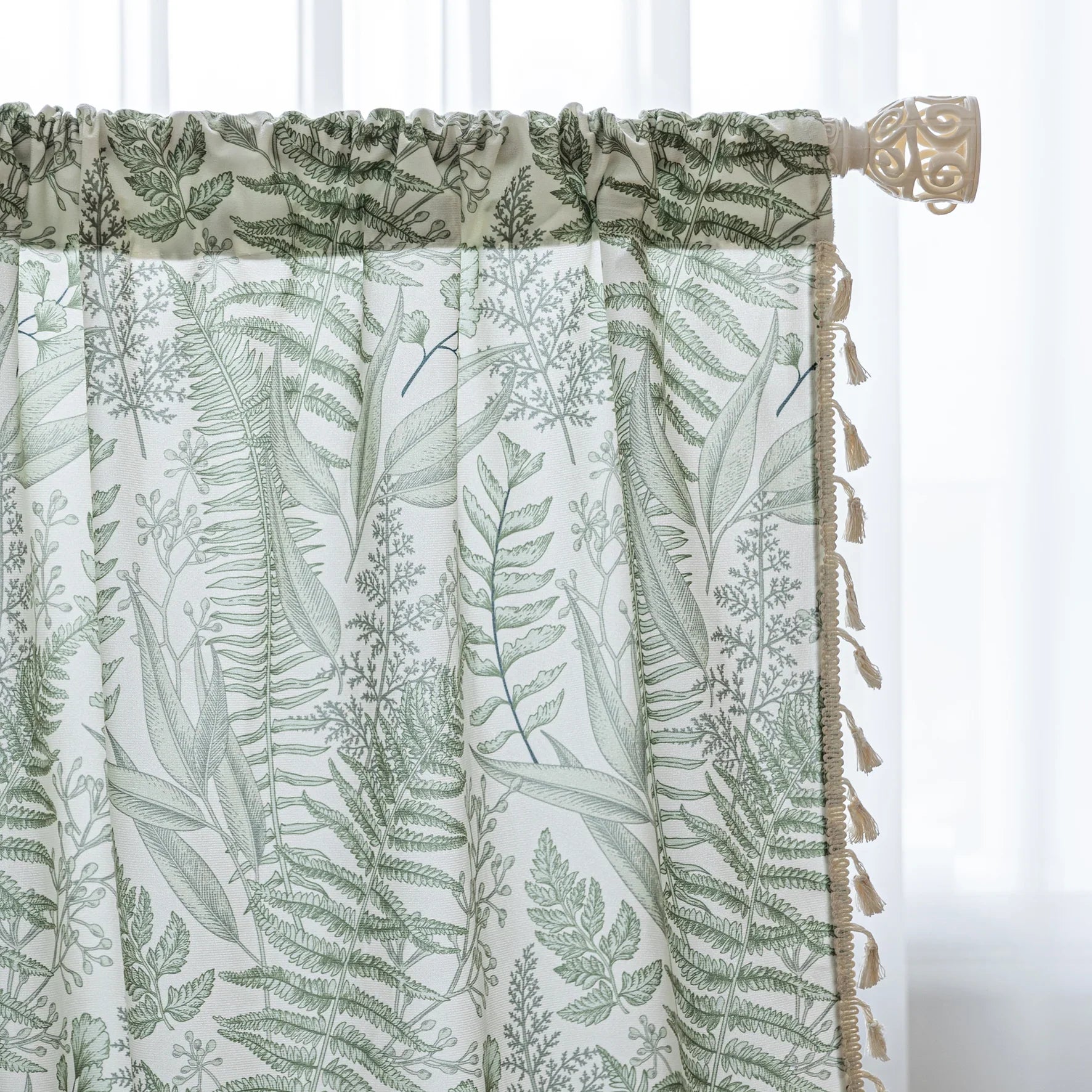 Botanical-themed curtain featuring lush green fern and leaf prints on a soft beige background, accented with delicate tassel trim — perfect for bringing a fresh, natural, and calming touch to any living space.