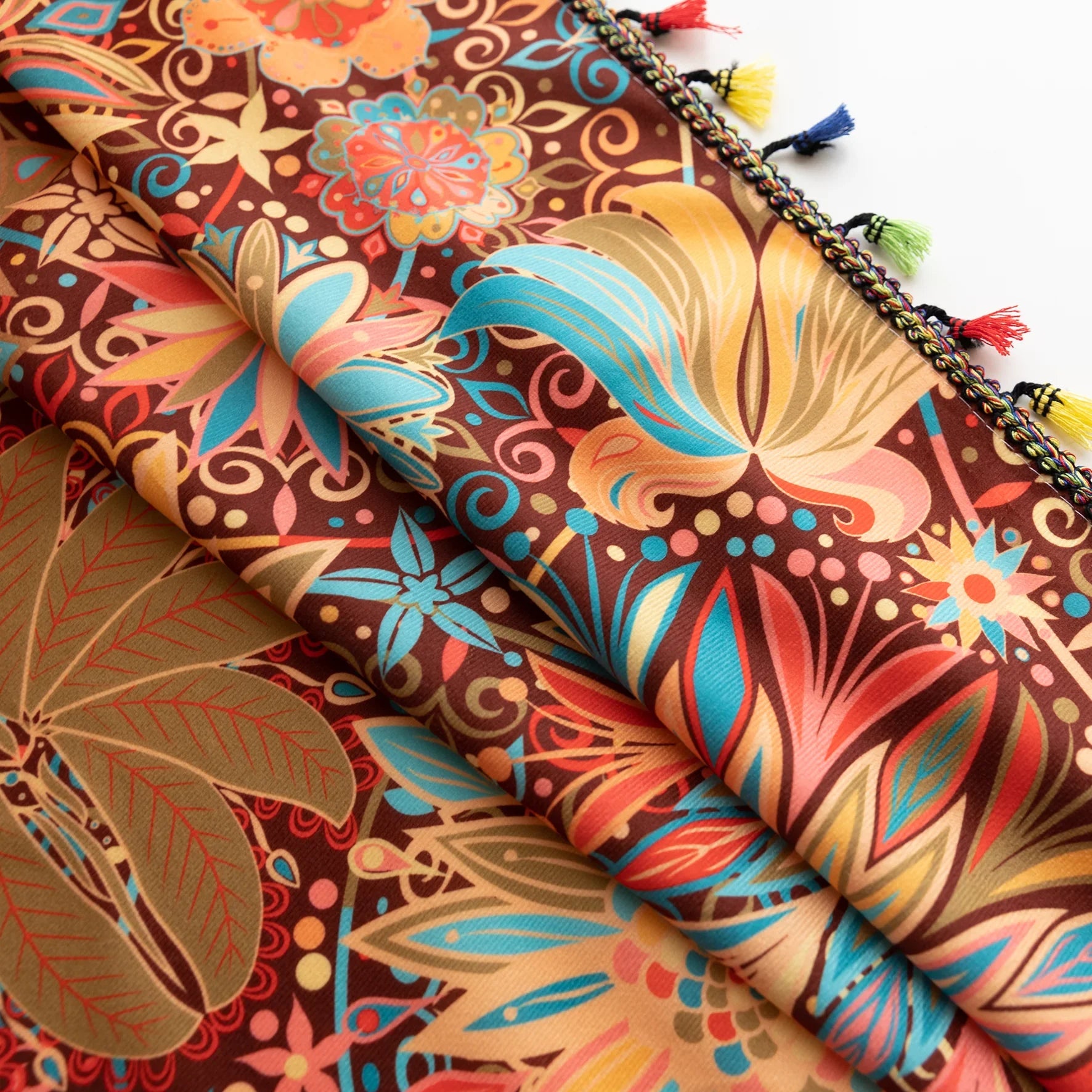 Vibrant bohemian curtain with intricate mandala and floral patterns in rich shades of red, turquoise, gold, and orange, finished with colorful tassel trim — perfect for adding an artistic, eclectic, and lively touch to any room decor.