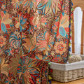 Vibrant bohemian curtain with intricate mandala and floral patterns in rich shades of red, turquoise, gold, and orange, finished with colorful tassel trim — perfect for adding an artistic, eclectic, and lively touch to any room decor.