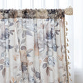 Chic beige curtain with soft watercolor-style floral prints in earthy tones of brown, taupe, and grey, accented with delicate tassel trim — ideal for adding a warm, elegant, and nature-inspired touch to any living space.