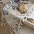 Chic beige curtain with soft watercolor-style floral prints in earthy tones of brown, taupe, and grey, accented with delicate tassel trim — ideal for adding a warm, elegant, and nature-inspired touch to any living space.