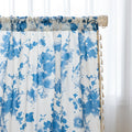 Elegant white curtain with soft watercolor-style blue floral prints, finished with delicate tassel trim — perfect for adding a fresh, airy, and romantic touch to your living room, bedroom, or cozy reading nook.