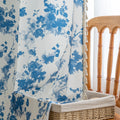 Elegant white curtain with soft watercolor-style blue floral prints, finished with delicate tassel trim — perfect for adding a fresh, airy, and romantic touch to your living room, bedroom, or cozy reading nook.