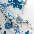 Elegant white curtain with soft watercolor-style blue floral prints, finished with delicate tassel trim — perfect for adding a fresh, airy, and romantic touch to your living room, bedroom, or cozy reading nook.