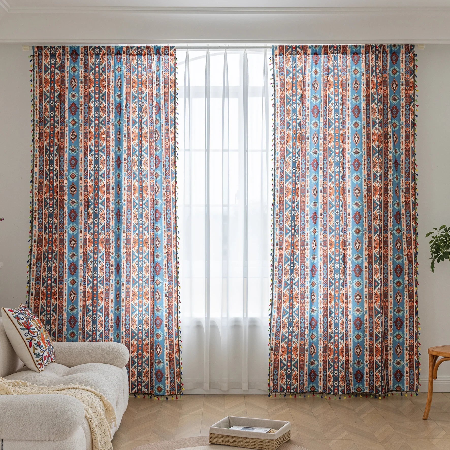 Vibrant bohemian curtain with a striking tribal geometric pattern in earthy rust, deep blue, and cream tones, accented with colorful tassel trim — perfect for adding warmth, character, and a Southwestern-inspired charm to any room.