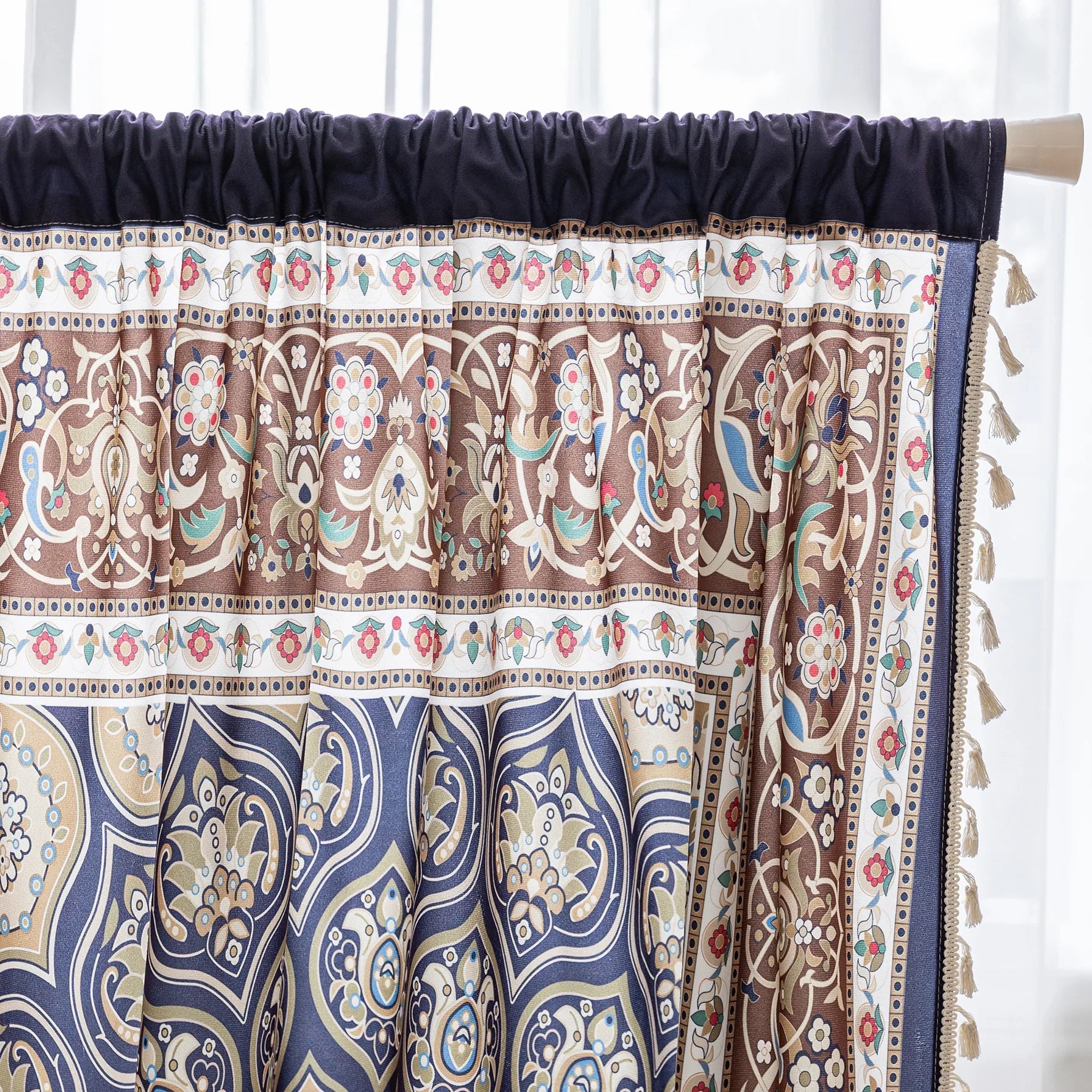 Luxurious bohemian curtain featuring an intricate mandala-inspired medallion design in rich navy blue, earthy brown, and soft beige tones, accented with elegant tassel trim — ideal for adding a touch of Moroccan or Middle Eastern charm to your living space.