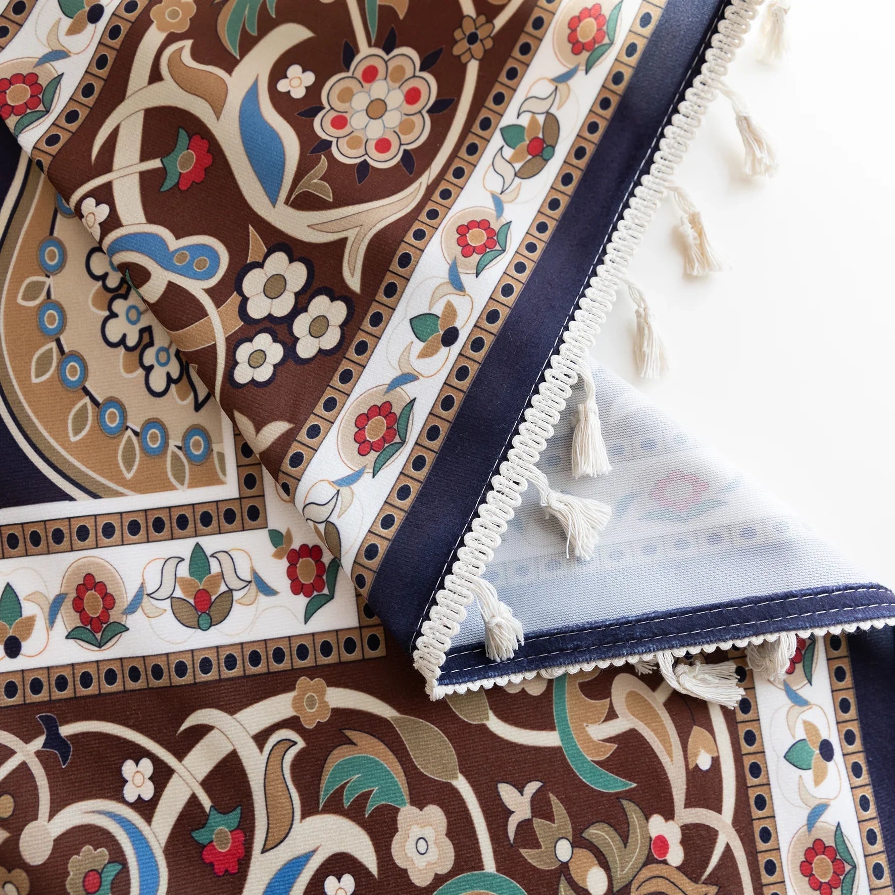 Luxurious bohemian curtain featuring an intricate mandala-inspired medallion design in rich navy blue, earthy brown, and soft beige tones, accented with elegant tassel trim — ideal for adding a touch of Moroccan or Middle Eastern charm to your living space.