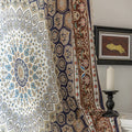 Luxurious bohemian curtain featuring an intricate mandala-inspired medallion design in rich navy blue, earthy brown, and soft beige tones, accented with elegant tassel trim — ideal for adding a touch of Moroccan or Middle Eastern charm to your living space.
