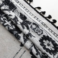 Elegant bohemian curtain in soft beige with intricate black floral and medallion motifs, finished with delicate black tassel trim — perfect for adding vintage charm and artistic flair to living rooms, bedrooms, or creative spaces.