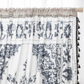 Elegant bohemian curtain in soft beige with intricate black floral and medallion motifs, finished with delicate black tassel trim — perfect for adding vintage charm and artistic flair to living rooms, bedrooms, or creative spaces.