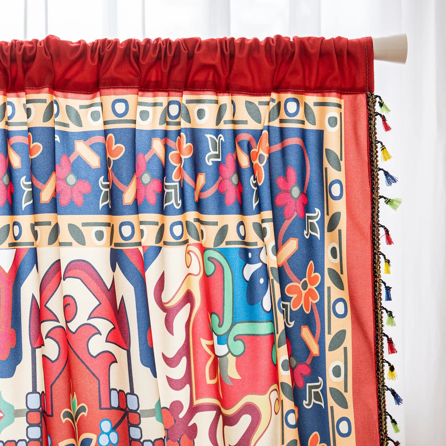 Bold and vibrant curtain featuring a striking red base with intricate multicolor floral and geometric patterns, framed by an ornate navy and gold border — perfect for adding warmth, personality, and cultural flair to your living space.
