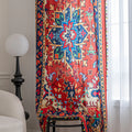 Bold and vibrant curtain featuring a striking red base with intricate multicolor floral and geometric patterns, framed by an ornate navy and gold border — perfect for adding warmth, personality, and cultural flair to your living space.