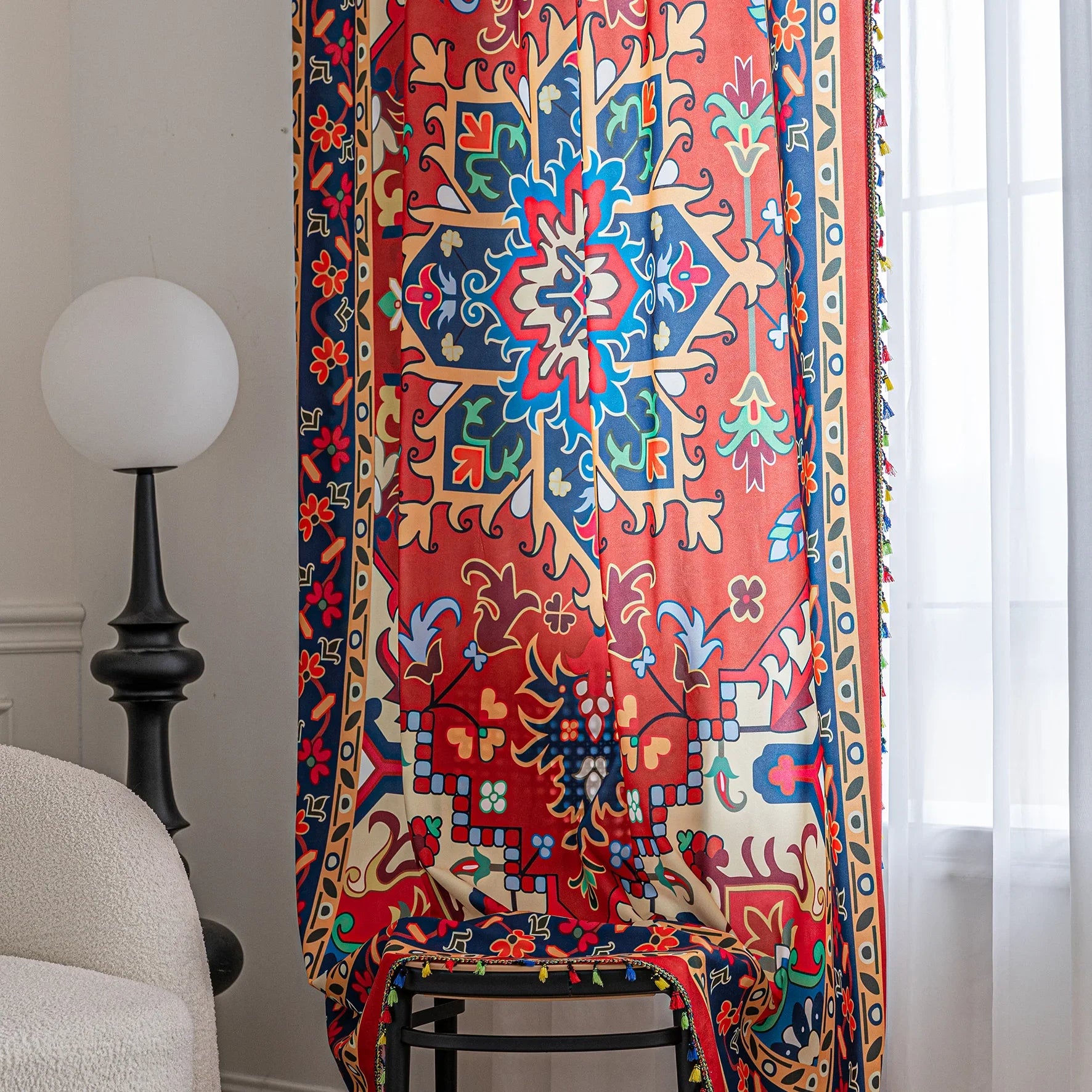 Bold and vibrant curtain featuring a striking red base with intricate multicolor floral and geometric patterns, framed by an ornate navy and gold border — perfect for adding warmth, personality, and cultural flair to your living space.