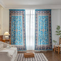 Luxurious curtain with a rich turquoise base, adorned with intricate floral and paisley patterns in warm earthy tones, framed by an ornate contrasting border — ideal for adding elegance and cultural charm to any room.