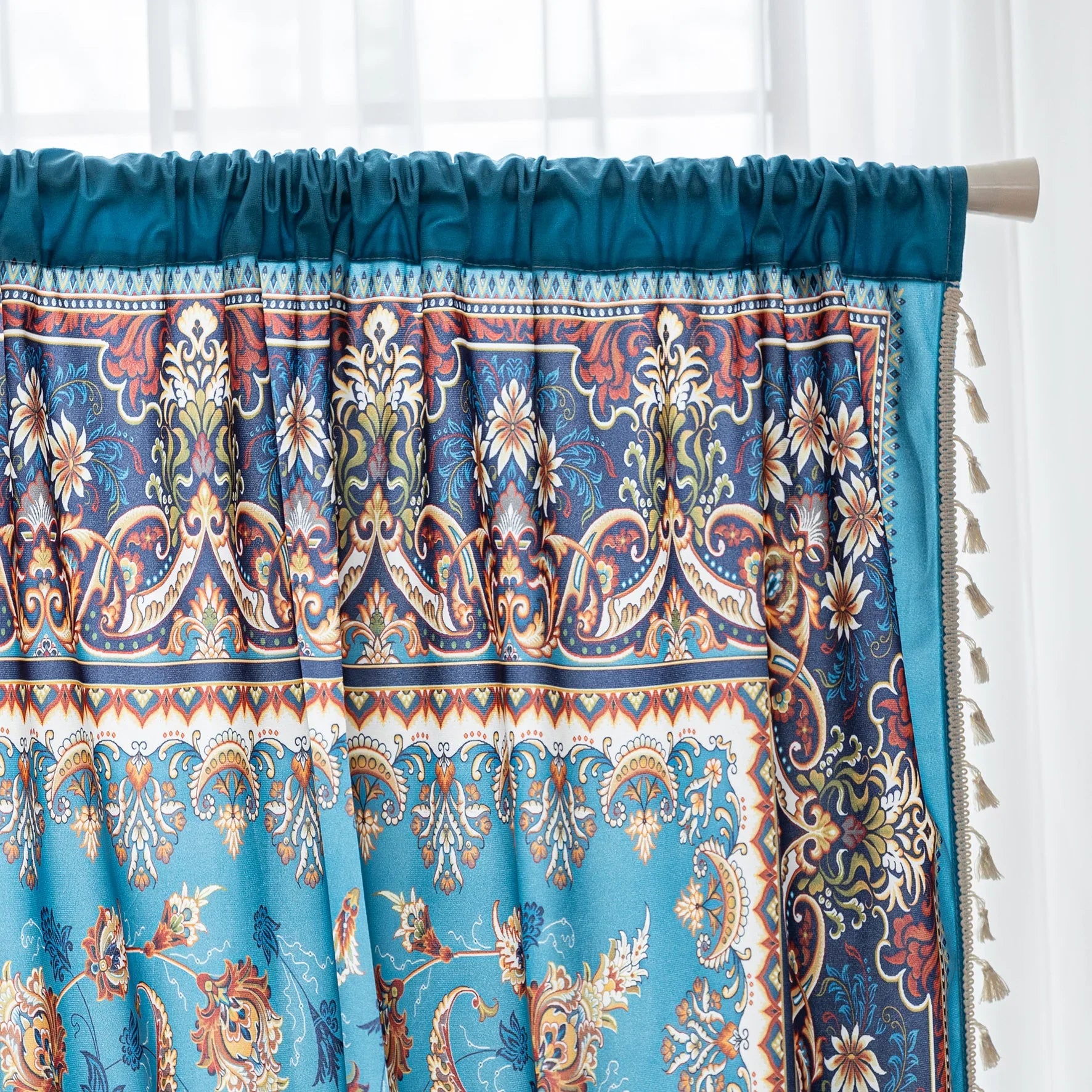 Luxurious curtain with a rich turquoise base, adorned with intricate floral and paisley patterns in warm earthy tones, framed by an ornate contrasting border — ideal for adding elegance and cultural charm to any room.