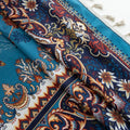 Luxurious curtain with a rich turquoise base, adorned with intricate floral and paisley patterns in warm earthy tones, framed by an ornate contrasting border — ideal for adding elegance and cultural charm to any room.