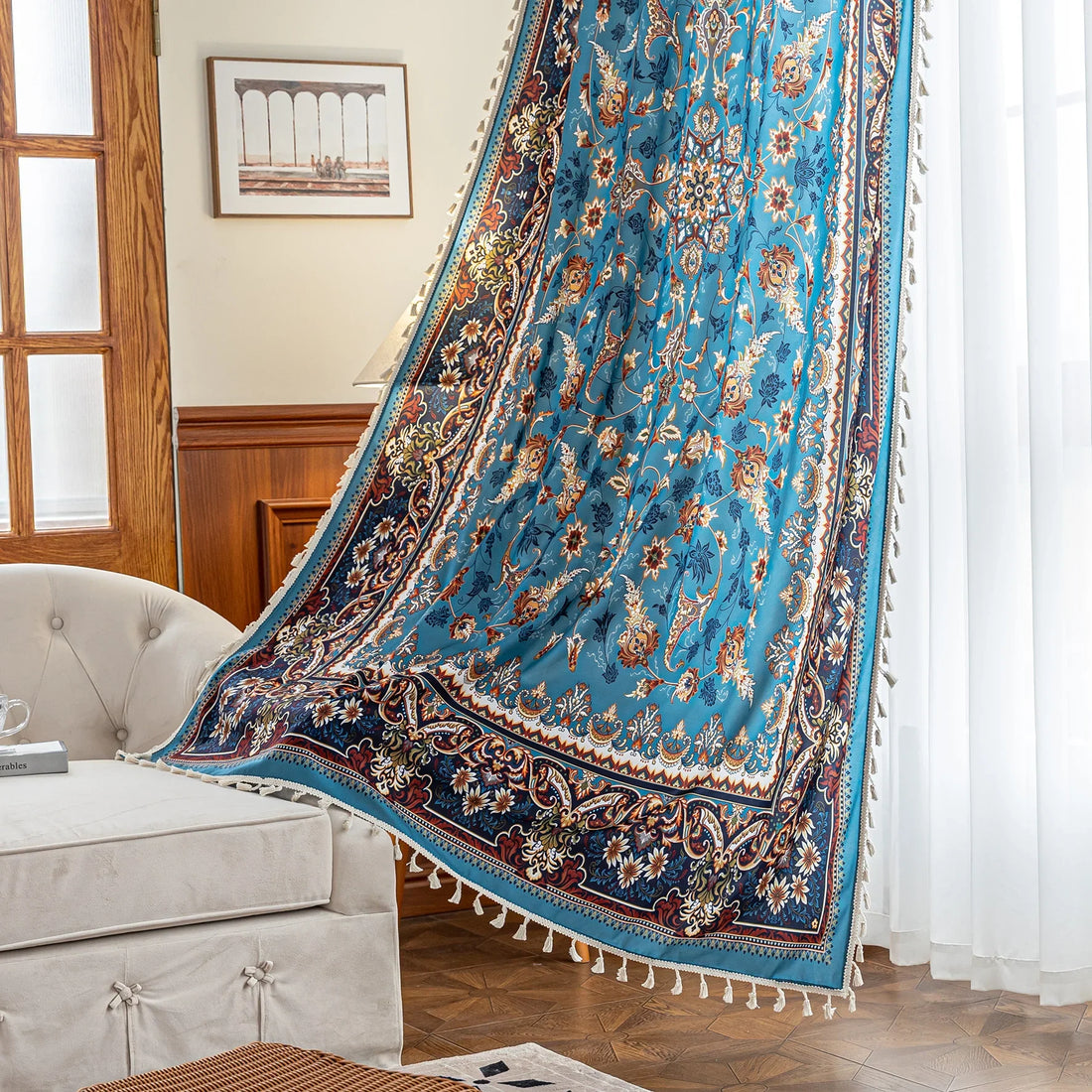 Luxurious curtain with a rich turquoise base, adorned with intricate floral and paisley patterns in warm earthy tones, framed by an ornate contrasting border — ideal for adding elegance and cultural charm to any room.