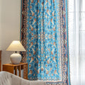 Luxurious curtain with a rich turquoise base, adorned with intricate floral and paisley patterns in warm earthy tones, framed by an ornate contrasting border — ideal for adding elegance and cultural charm to any room.