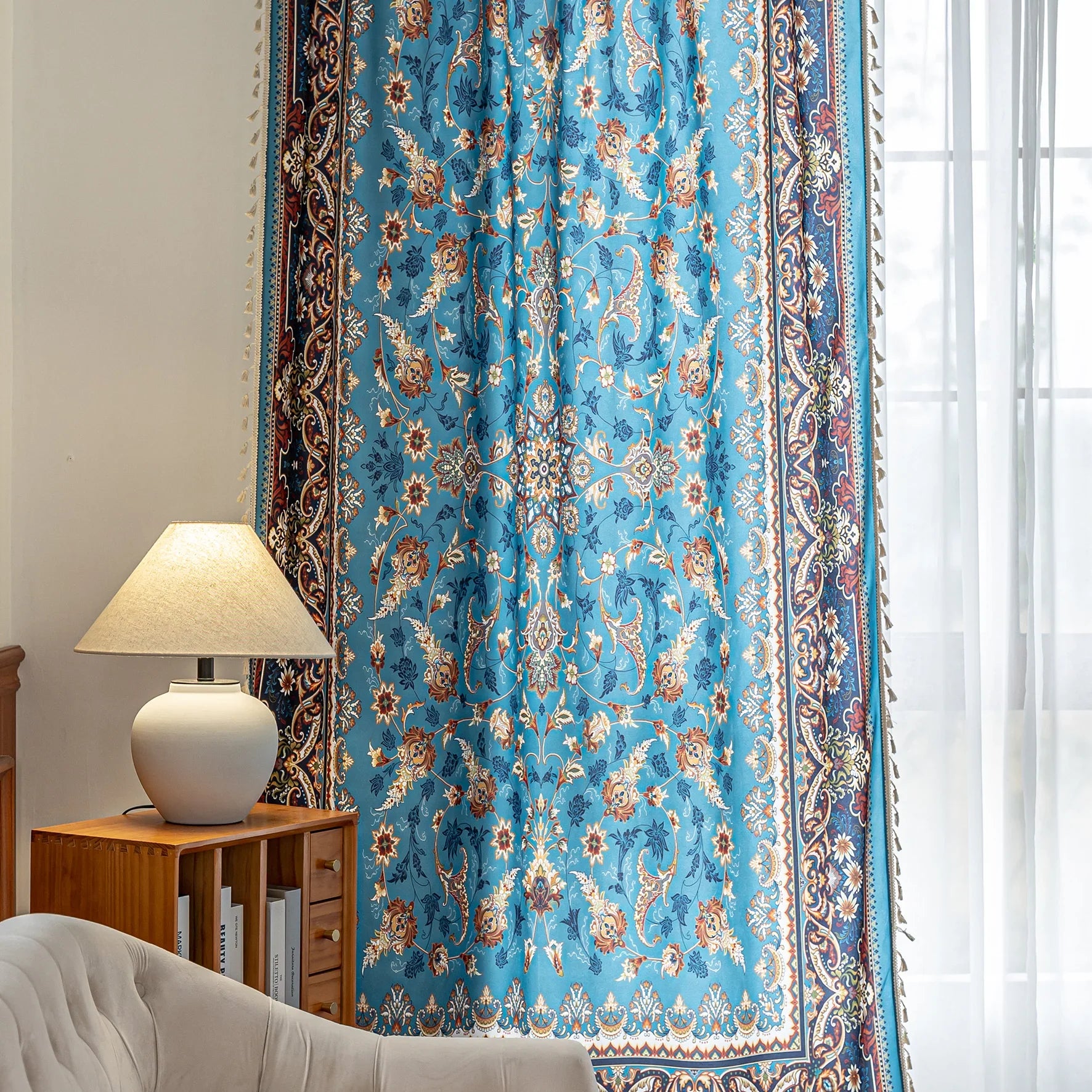 Luxurious curtain with a rich turquoise base, adorned with intricate floral and paisley patterns in warm earthy tones, framed by an ornate contrasting border — ideal for adding elegance and cultural charm to any room.