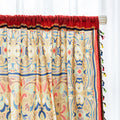 Elegant curtain with intricate multicolor floral and geometric patterns, framed by a decorative border and colorful tassels — perfect for adding a vibrant, artistic touch to any living space.