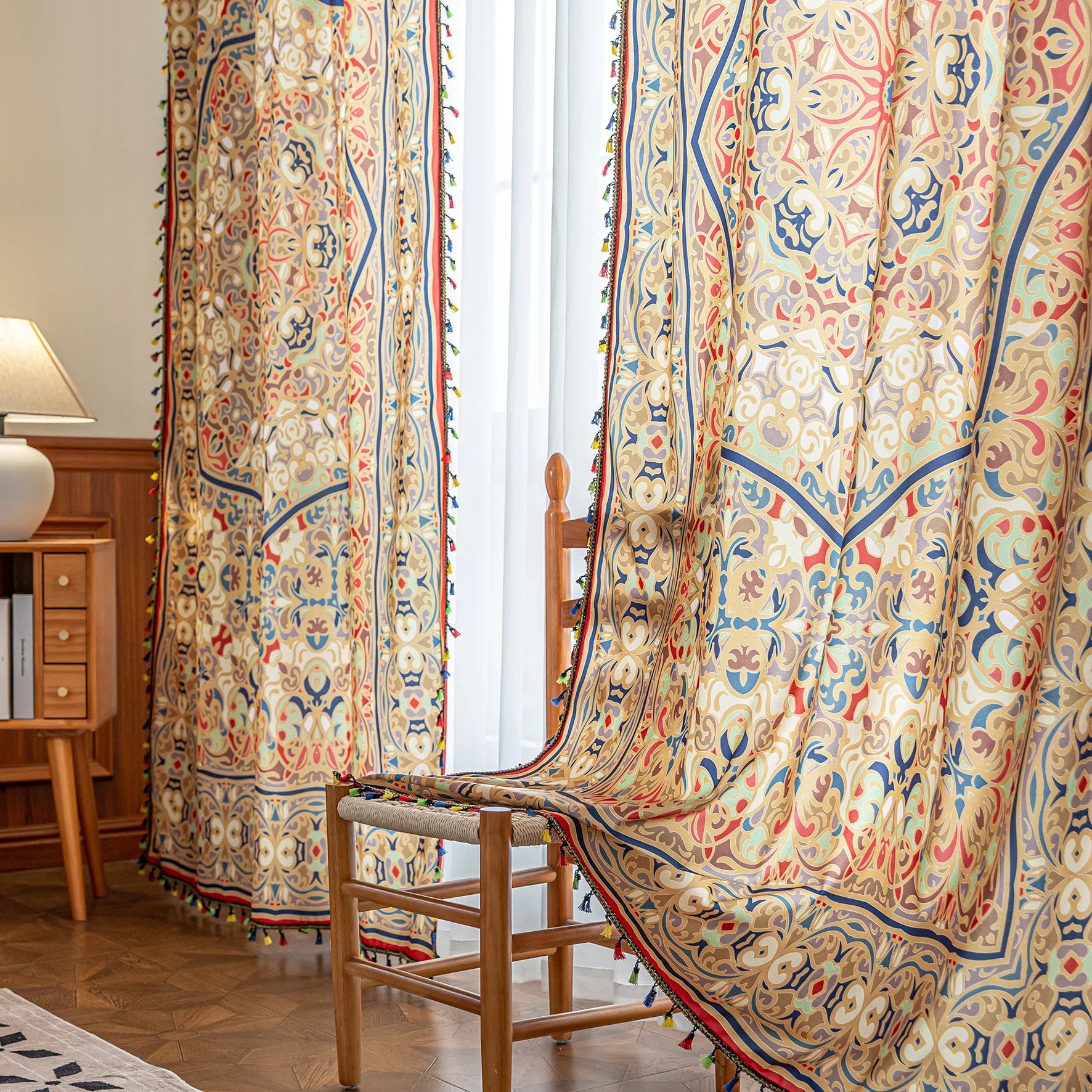 Elegant curtain with intricate multicolor floral and geometric patterns, framed by a decorative border and colorful tassels — perfect for adding a vibrant, artistic touch to any living space.