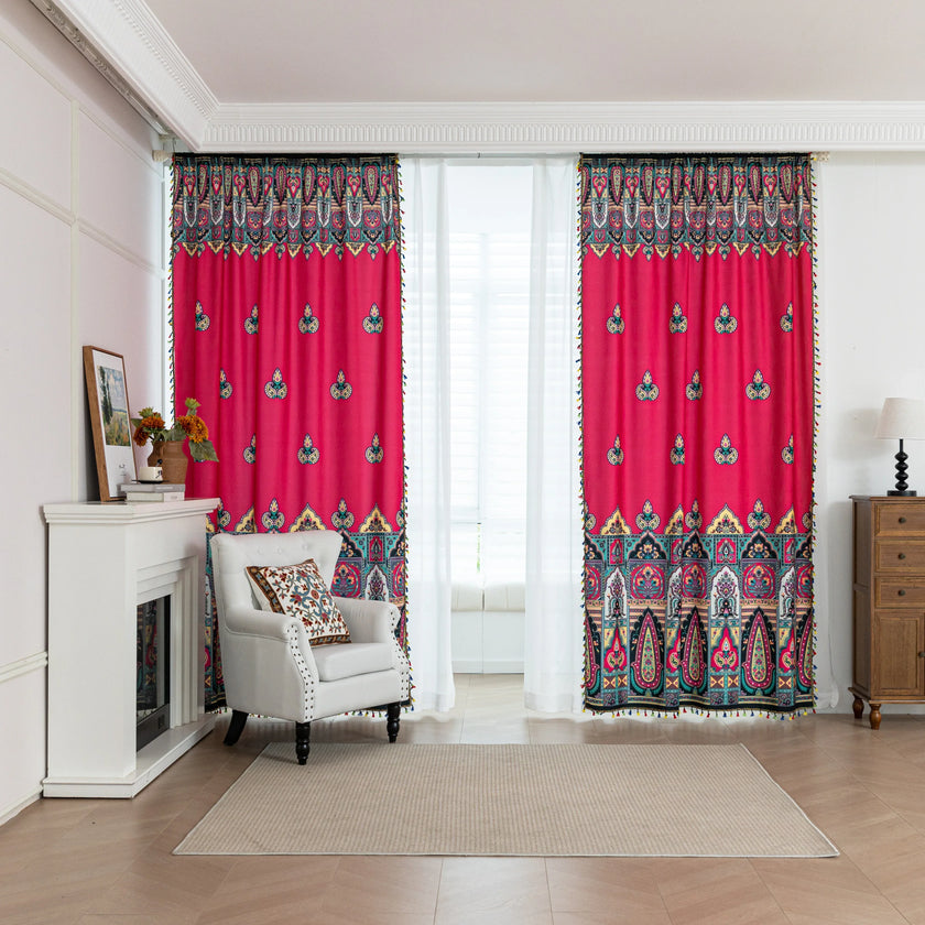 Vibrant Red Bohemian Curtains ¨C Infuse your home with bold color and artistic flair using these stunning red curtains adorned with intricate multicolor ethnic patterns. The rich crimson backdrop is complemented by an elaborate border design in green, gold, and black, with small paisley-style motifs scattered throughout. Crafted from lightweight fabric, they softly filter sunlight while adding a warm, inviting atmosphere to any room. Perfect for living rooms, bedrooms, or creative spaces, these tassel-trimm