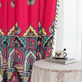 Vibrant Red Bohemian Curtains – Infuse your home with bold color and artistic flair using these stunning red curtains adorned with intricate multicolor ethnic patterns. The rich crimson backdrop is complemented by an elaborate border design in green, gold, and black, with small paisley-style motifs scattered throughout. Crafted from lightweight fabric, they softly filter sunlight while adding a warm, inviting atmosphere to any room. Perfect for living rooms, bedrooms, or creative spaces, these tassel-trimme