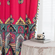 Vibrant Red Bohemian Curtains ¨C Infuse your home with bold color and artistic flair using these stunning red curtains adorned with intricate multicolor ethnic patterns. The rich crimson backdrop is complemented by an elaborate border design in green, gold, and black, with small paisley-style motifs scattered throughout. Crafted from lightweight fabric, they softly filter sunlight while adding a warm, inviting atmosphere to any room. Perfect for living rooms, bedrooms, or creative spaces, these tassel-trimm