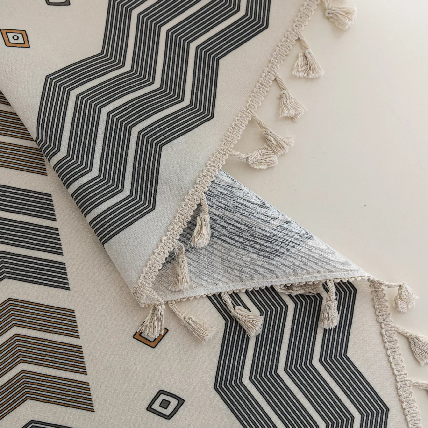 Boho Geometric Patterned Curtains – Elevate your home décor with these elegant cream curtains featuring intricate tribal-inspired geometric designs in earthy gray, beige, and gold tones. Crafted from soft, breathable fabric, they allow gentle natural light to filter through while providing a cozy, inviting atmosphere. The stylish tassel trim adds a charming bohemian touch, making them perfect for living rooms, bedrooms, or creative spaces seeking a modern yet warm aesthetic.
