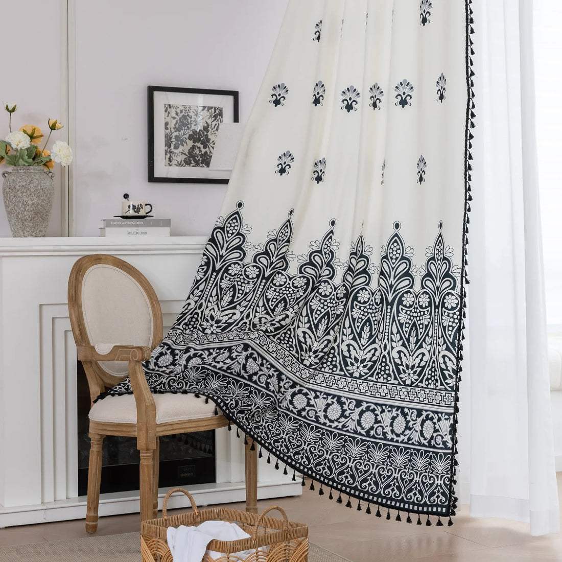 Elegant Black and White Bohemian Curtains – Add timeless charm to your home with these white curtains adorned with intricate black floral and paisley patterns. The bold border design at the base transitions into delicate motifs toward the top, creating a balanced, eye-catching look. Made from soft, lightweight fabric, they allow natural light to filter through while maintaining privacy. Perfect for living rooms, bedrooms, or creative spaces, these tassel-trimmed curtains bring a sophisticated boho vibe to 
