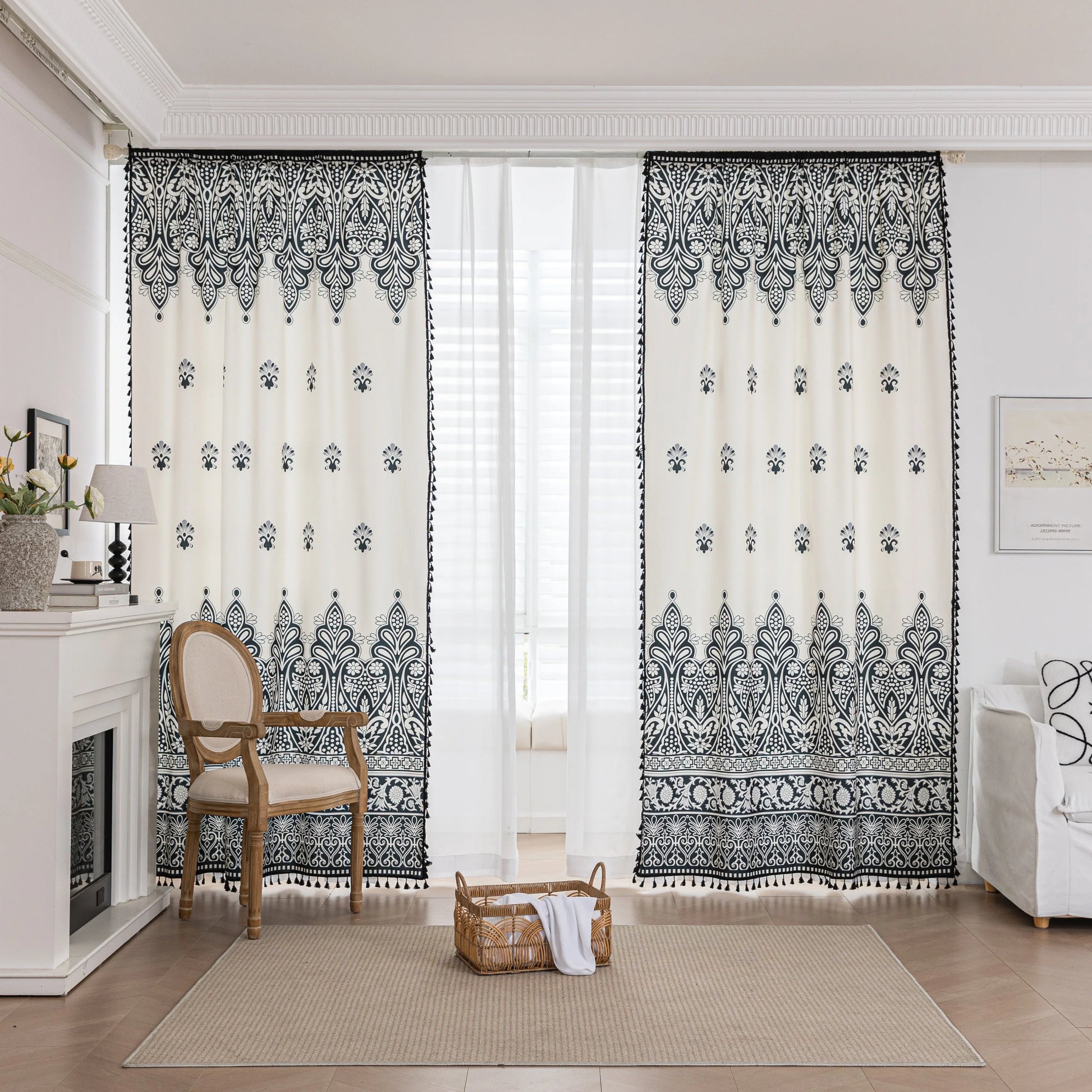 Elegant Black and White Bohemian Curtains – Add timeless charm to your home with these white curtains adorned with intricate black floral and paisley patterns. The bold border design at the base transitions into delicate motifs toward the top, creating a balanced, eye-catching look. Made from soft, lightweight fabric, they allow natural light to filter through while maintaining privacy. Perfect for living rooms, bedrooms, or creative spaces, these tassel-trimmed curtains bring a sophisticated boho vibe to a
