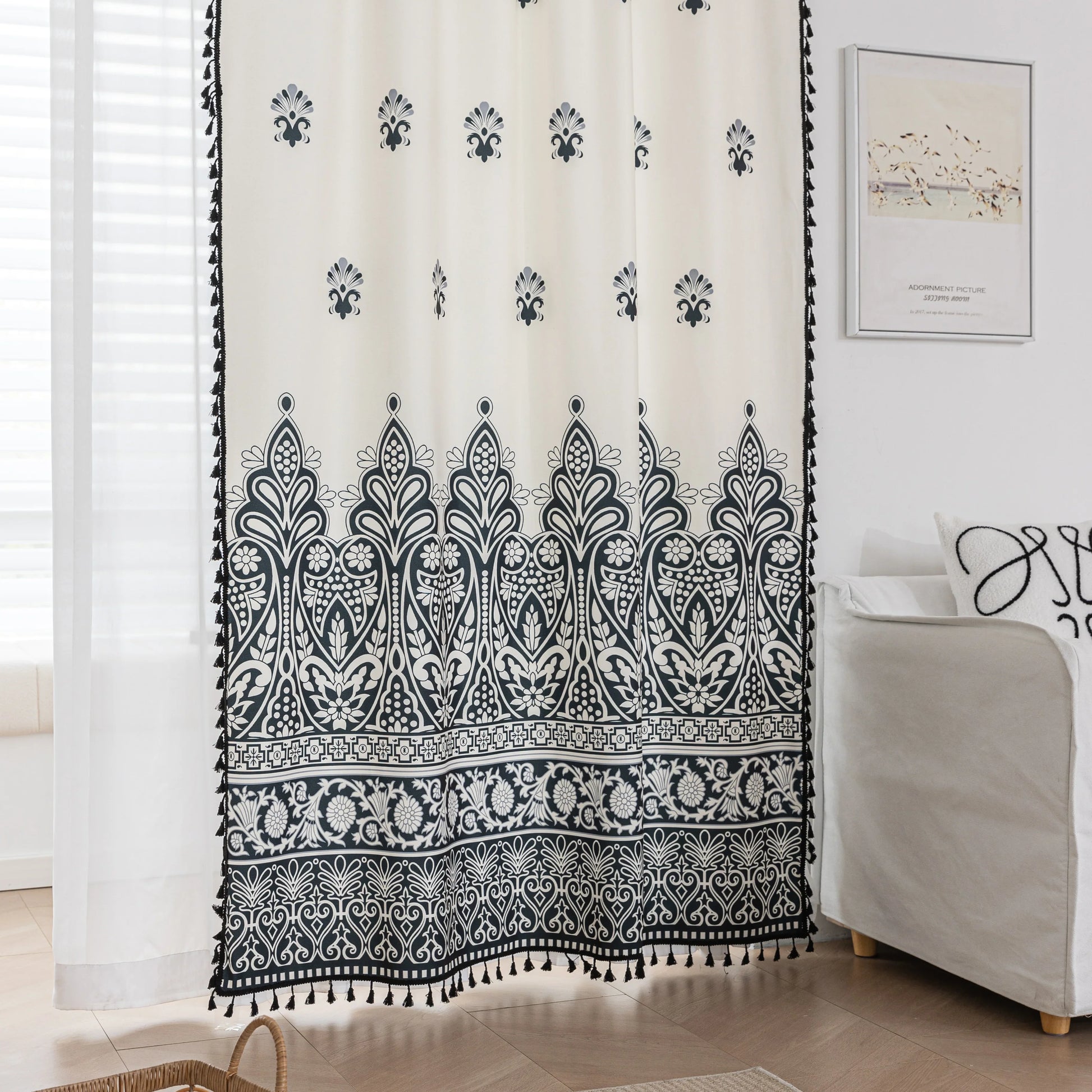 Elegant Black and White Bohemian Curtains – Add timeless charm to your home with these white curtains adorned with intricate black floral and paisley patterns. The bold border design at the base transitions into delicate motifs toward the top, creating a balanced, eye-catching look. Made from soft, lightweight fabric, they allow natural light to filter through while maintaining privacy. Perfect for living rooms, bedrooms, or creative spaces, these tassel-trimmed curtains bring a sophisticated boho vibe to a