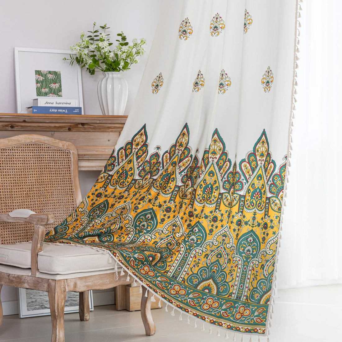 Bohemian Paisley Print Curtains – Brighten your space with these vibrant white curtains featuring an intricate paisley design in rich yellow, green, and red tones. The elegant pattern starts at the base and gracefully fades upward, adding a unique artistic touch to your home décor. Made from lightweight, breathable fabric, they allow soft natural light to flow in while enhancing any living room, bedroom, or creative space with a warm, eclectic charm. Tassel trim along the edges completes the boho-inspired l