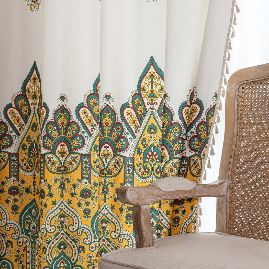 Bohemian Paisley Print Curtains – Brighten your space with these vibrant white curtains featuring an intricate paisley design in rich yellow, green, and red tones. The elegant pattern starts at the base and gracefully fades upward, adding a unique artistic touch to your home décor. Made from lightweight, breathable fabric, they allow soft natural light to flow in while enhancing any living room, bedroom, or creative space with a warm, eclectic charm. Tassel trim along the edges completes the boho-inspired l