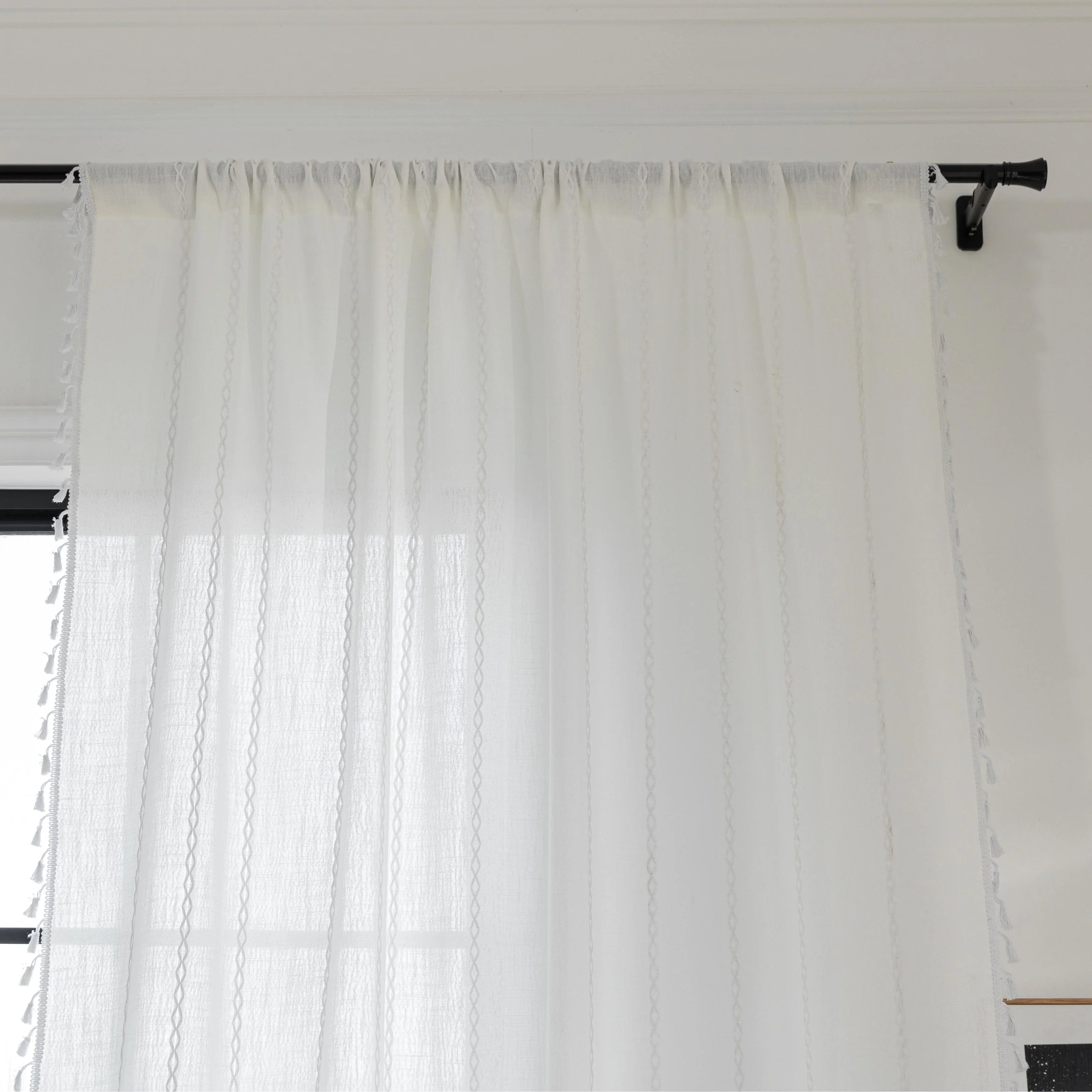 Elegant White Tassel Curtains ¨C Bring timeless charm and brightness to your home with these beautiful white curtains, featuring subtle vertical embroidery and delicate tassel trim. Crafted from soft, airy fabric, they allow natural light to flow in while preserving your privacy. Perfect for living rooms, bedrooms, or dining spaces, their clean, versatile design complements modern, minimalist, coastal, or bohemian d¨¦cor styles. Durable, easy to maintain, and effortlessly stylish, these curtains add a fresh