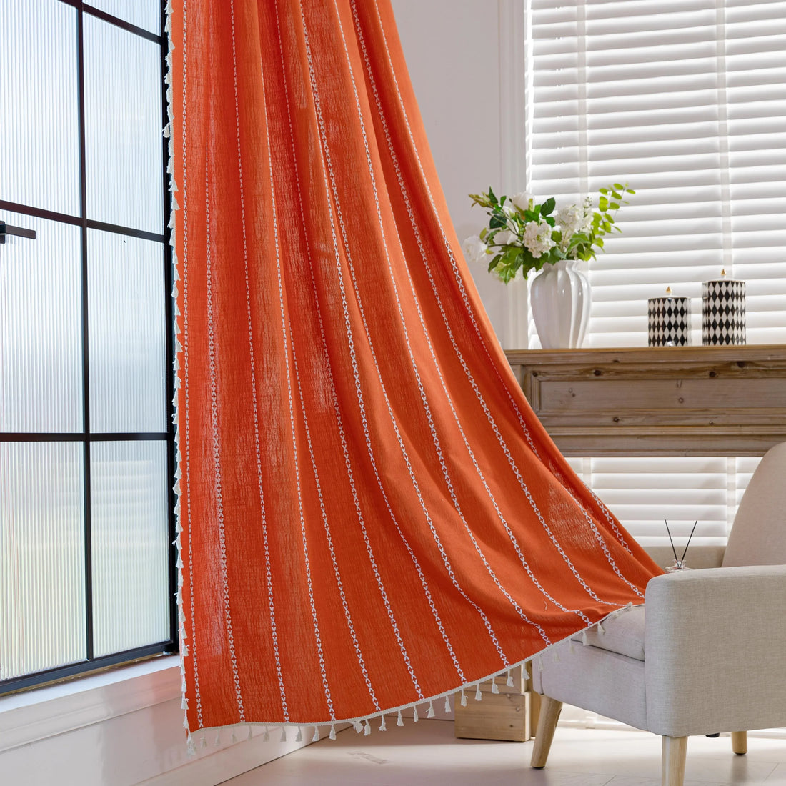 Vibrant Orange Tassel Curtains – Brighten up your space with these stunning orange curtains featuring elegant vertical white embroidery and charming tassel trim. Made from soft, breathable fabric, they allow gentle natural light to filter through while maintaining privacy. Perfect for adding a cheerful, modern touch to living rooms, bedrooms, or creative spaces, their bold color and artisanal detailing blend seamlessly with bohemian, eclectic, or contemporary décor. Durable, easy to care for, and stylish, t