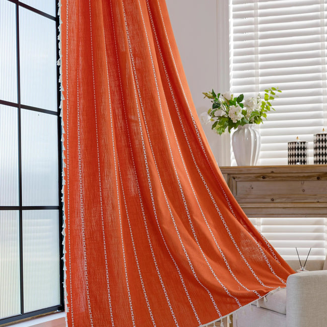 Vibrant Orange Tassel Curtains ¨C Brighten up your space with these stunning orange curtains featuring elegant vertical white embroidery and charming tassel trim. Made from soft, breathable fabric, they allow gentle natural light to filter through while maintaining privacy. Perfect for adding a cheerful, modern touch to living rooms, bedrooms, or creative spaces, their bold color and artisanal detailing blend seamlessly with bohemian, eclectic, or contemporary d¨¦cor. Durable, easy to care for, and stylish,